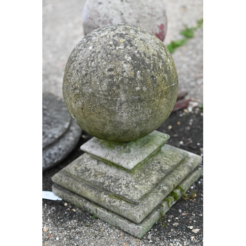 76 - A trio of weathered cast stone ball finials and bases, sizes and designs differ (3)