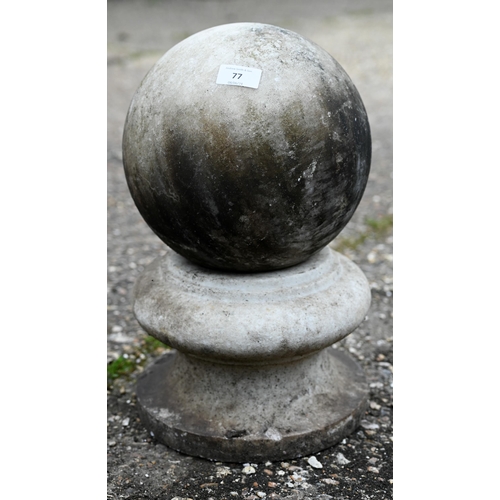 77 - A weathered marble ball finial on socle base, 24 cm dia. x 43 cm h