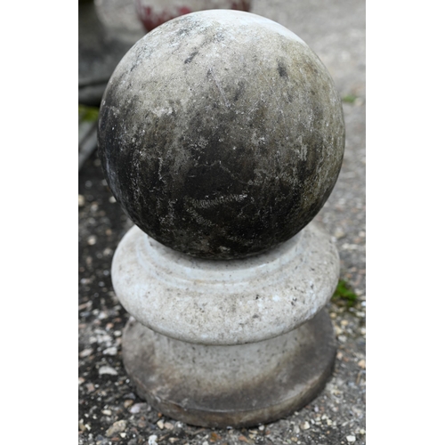 77 - A weathered marble ball finial on socle base, 24 cm dia. x 43 cm h