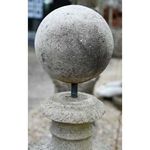 8 - An old weathered cast stone ball finial raised on associated square plinth base