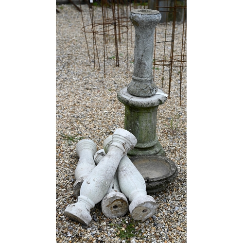 89 - A cast stone weathered associated three piece bird bath to/with four architectural balustrade compon... 