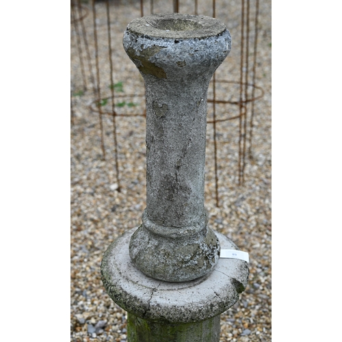 89 - A cast stone weathered associated three piece bird bath to/with four architectural balustrade compon... 