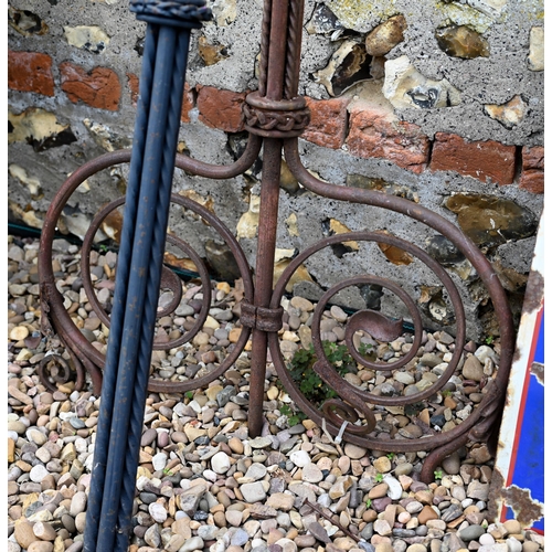 93 - Two differing ornate wrought iron garden lighting frames/stands with butterflied spiral finials - bo... 