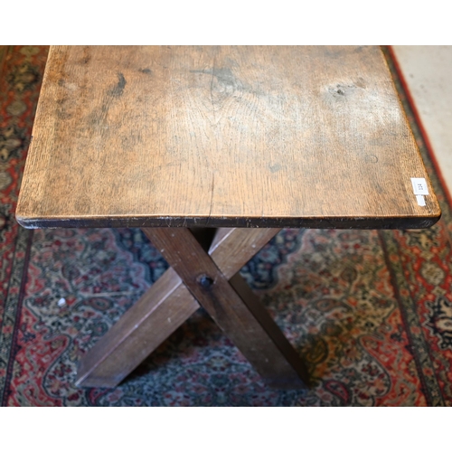 114 - An old oak 'X' frame dining table with high level centre stretcher, 145 cm x 60 cm x 72 cm h