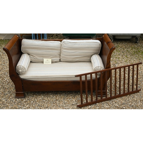 126 - Simon Horn, a traditional cherrywood day bed/cot, with cushions, spare guard and instructions manual... 