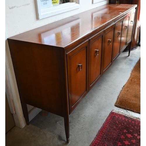 199 - A mid-century teak sideboard with panelled cupboards enclosing shelves and drawers, 206  46 x 8... 