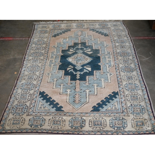 287 - A Turkish Milas geometric rug in pastel hues, 180 x 117 cm to/w Pakistani Turkoman style teal ground... 