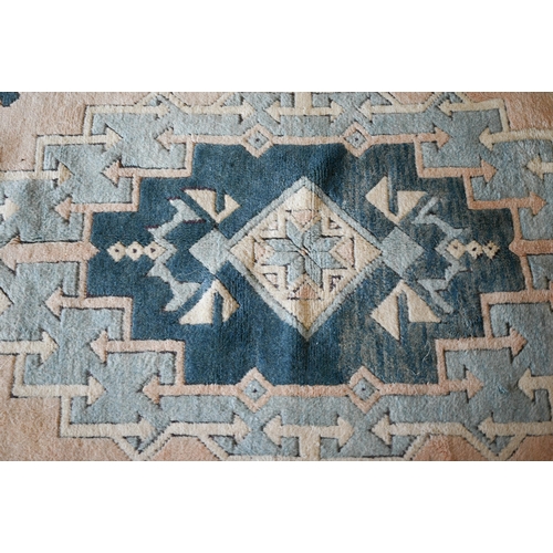 287 - A Turkish Milas geometric rug in pastel hues, 180 x 117 cm to/w Pakistani Turkoman style teal ground... 