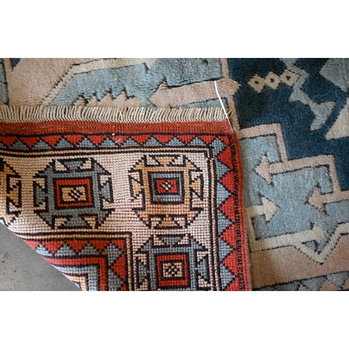 287 - A Turkish Milas geometric rug in pastel hues, 180 x 117 cm to/w Pakistani Turkoman style teal ground... 