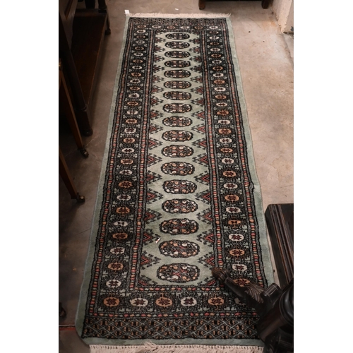 287 - A Turkish Milas geometric rug in pastel hues, 180 x 117 cm to/w Pakistani Turkoman style teal ground... 