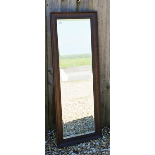 301 - # Three various bevelled wall mirrors in stained oak frames