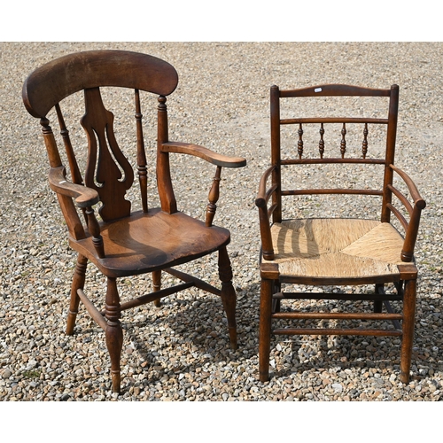 318 - A beech and elm elbow chair to/w a rush-seated elbow chair (2)