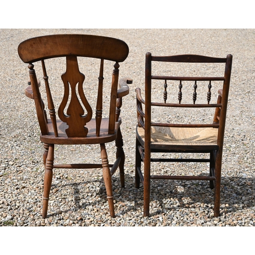 318 - A beech and elm elbow chair to/w a rush-seated elbow chair (2)