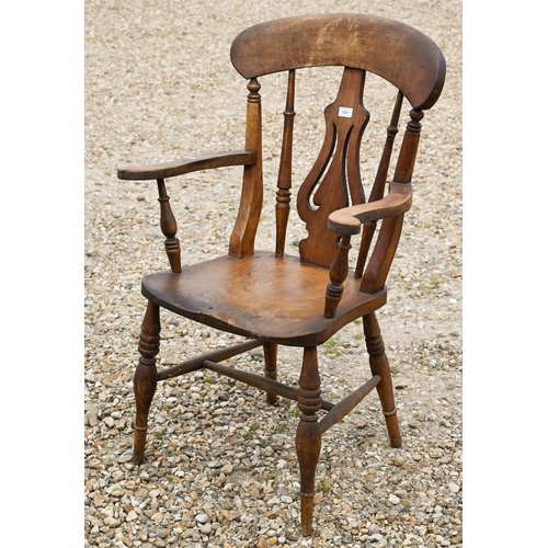 318 - A beech and elm elbow chair to/w a rush-seated elbow chair (2)