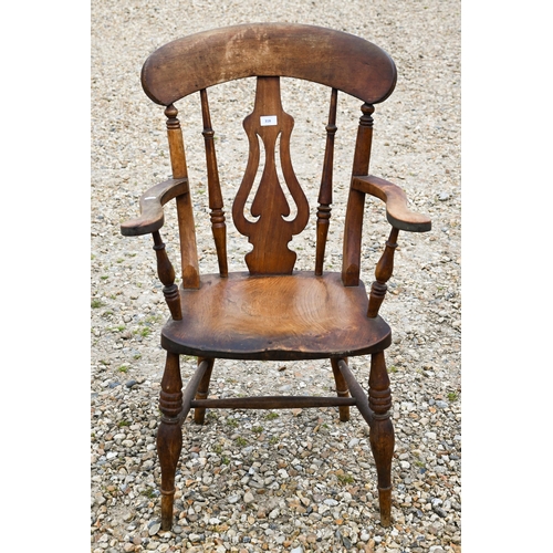 318 - A beech and elm elbow chair to/w a rush-seated elbow chair (2)