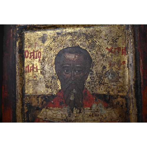 399 - An antique Greek Orthodox polychrome and gilt icon, 24 x 17 cm