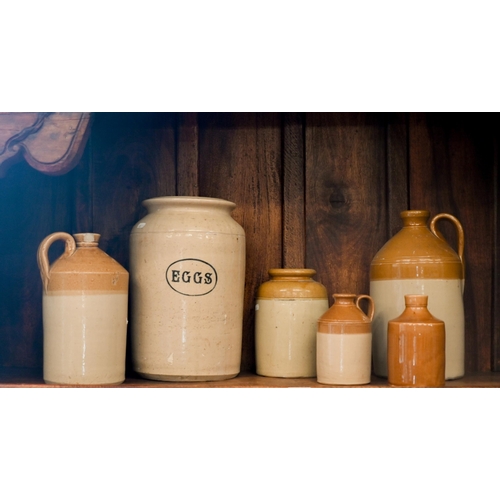 Six various stoneware flagon jars, including one for 'Eggs' (6)