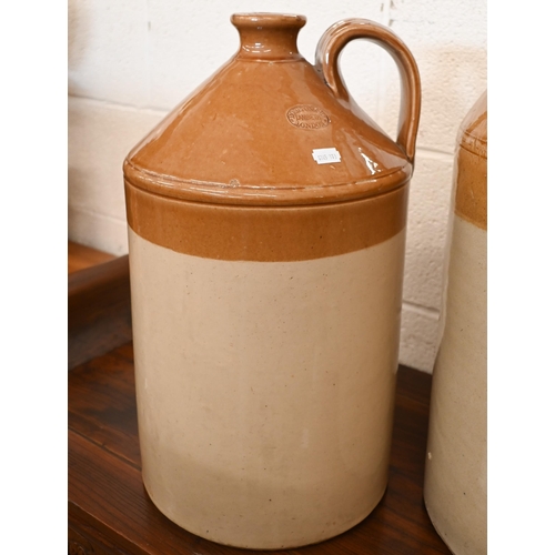 437A - A large 6-gallon stoneware flagon stamped for E H James of Birmingham, a Doulton Lambeth flagon and ... 