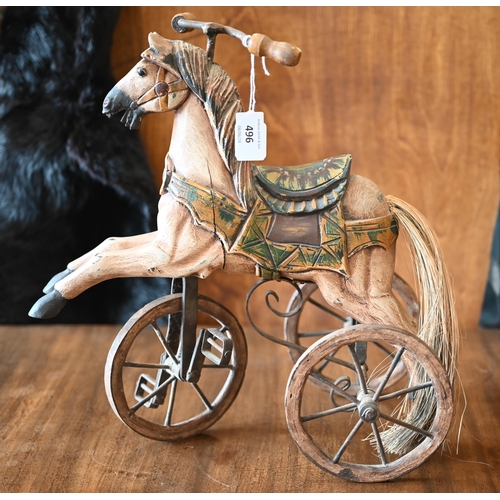 496 - A miniature 'hobby horse' tricycle 35 x 35 cm