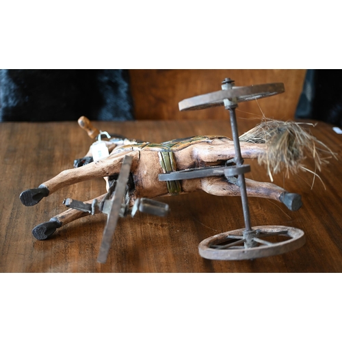 496 - A miniature 'hobby horse' tricycle 35 x 35 cm