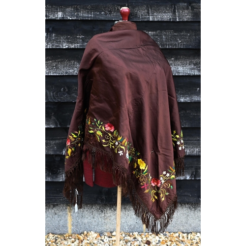 503 - A brown silk triangular piano shawl with colourful longstitched floral border and knotted fringe, 14... 