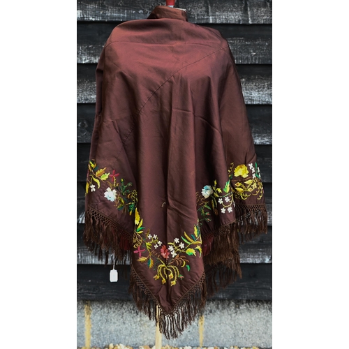 503 - A brown silk triangular piano shawl with colourful longstitched floral border and knotted fringe, 14... 