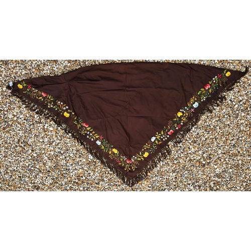 503 - A brown silk triangular piano shawl with colourful longstitched floral border and knotted fringe, 14... 