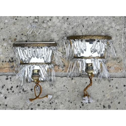 508 - A set of four half-hoop wall lights hung with two tiers of lustres and two brass twin-handle wall sc... 