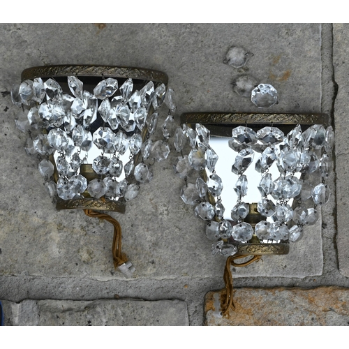 508 - A set of four half-hoop wall lights hung with two tiers of lustres and two brass twin-handle wall sc... 