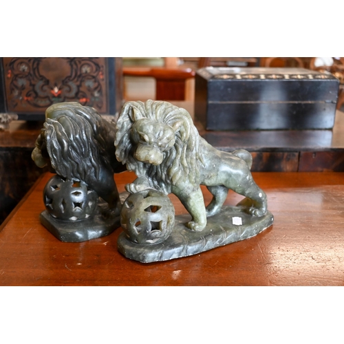 510 - A pair of Chinese serpentine lions, 20 cm long