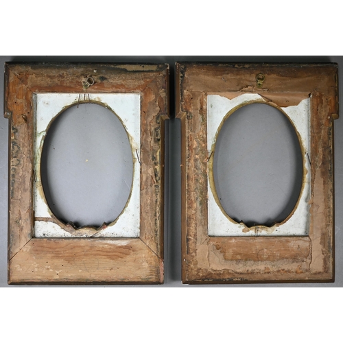 525 - A pair of 19th century gilt gesso frames with oval apertures, floral and ribbon mouldings, 38 x 28 c... 