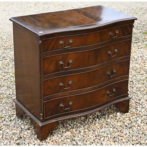 528 - A reproduction mahogany serpentine front chest of four long drawers on bracket feet