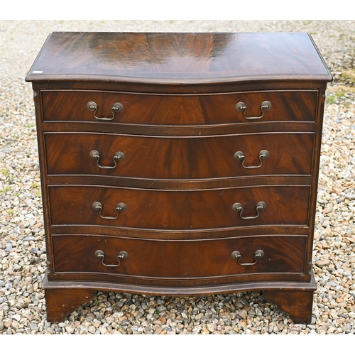 528 - A reproduction mahogany serpentine front chest of four long drawers on bracket feet