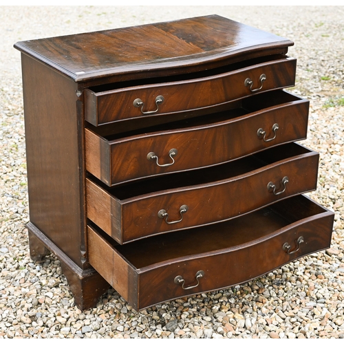 528 - A reproduction mahogany serpentine front chest of four long drawers on bracket feet