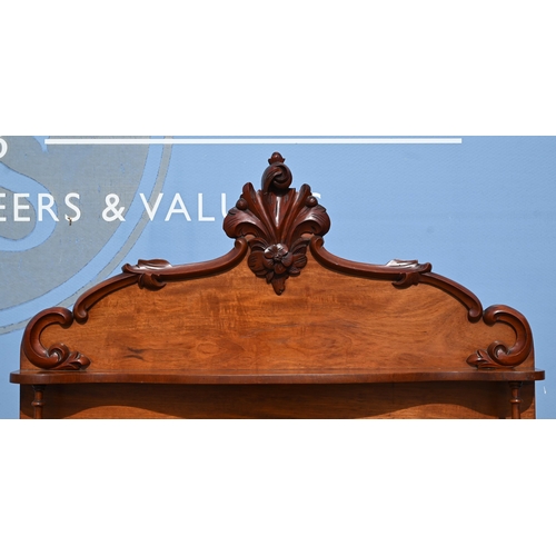 534 - A Victorian carved mahogany chiffonier with raised back over a cushion moulded drawer and panelled c... 