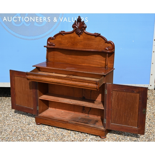 534 - A Victorian carved mahogany chiffonier with raised back over a cushion moulded drawer and panelled c... 