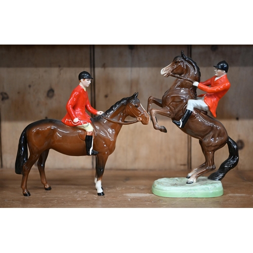 447 - Two Beswick huntsmen and a huntswoman to/w a fox-hound (4)