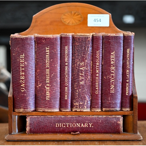 454 - An Edwardian Asprey & Houghton & Gunn (Bond Street) inlaid satinwood small bookcase containi... 