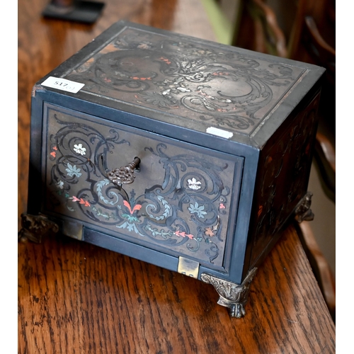 517 - A 19th century continental contre-boulle ebonized and inlaid table cabinet with fall-front enclosing... 