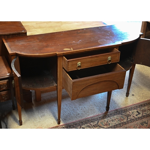 320 - #A Victorian mahogany cross-banded breakfront sideboard, centred by a drawer over a shaped apron dra... 