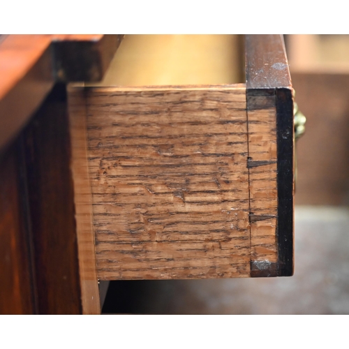 320 - #A Victorian mahogany cross-banded breakfront sideboard, centred by a drawer over a shaped apron dra... 