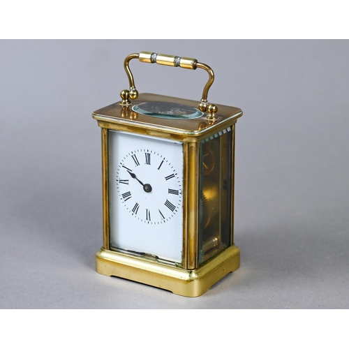 515 - A small French brass single drum 8-day carriage clock, with white enamelled dial with Roman numerals... 