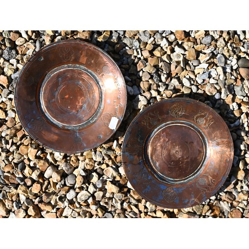 523 - An antique copper Middle Eastern coffee pot and two plates, to/w a fireside companion set, pair of b... 