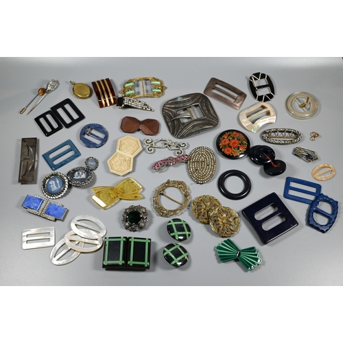 339 - A collection of vintage buckles, clips and buttons including mother of pearl, gilt metal, acrylic, e... 