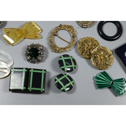 339 - A collection of vintage buckles, clips and buttons including mother of pearl, gilt metal, acrylic, e... 