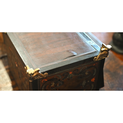 517 - A 19th century continental contre-boulle ebonized and inlaid table cabinet with fall-front enclosing... 