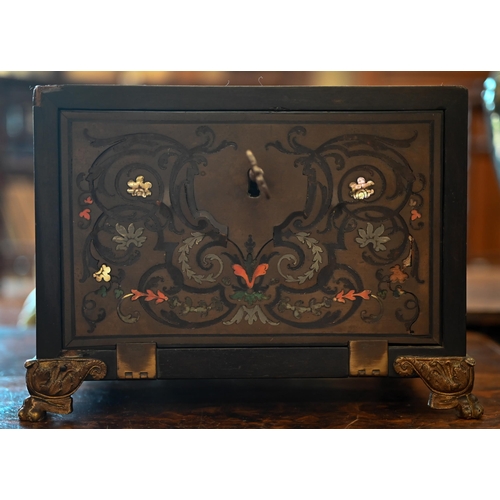 517 - A 19th century continental contre-boulle ebonized and inlaid table cabinet with fall-front enclosing... 