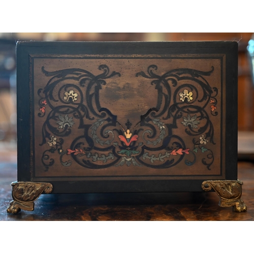 517 - A 19th century continental contre-boulle ebonized and inlaid table cabinet with fall-front enclosing... 