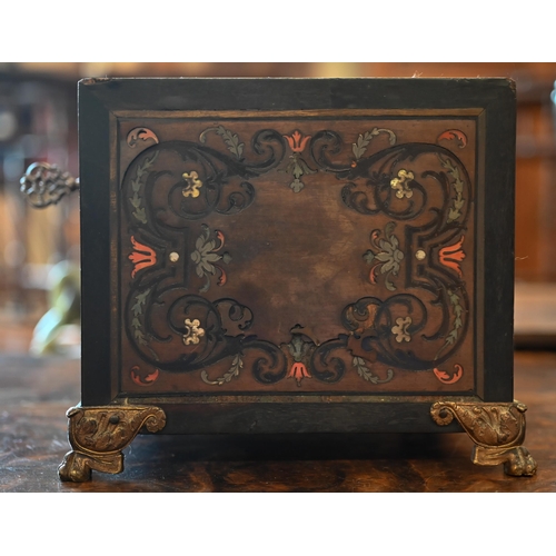 517 - A 19th century continental contre-boulle ebonized and inlaid table cabinet with fall-front enclosing... 