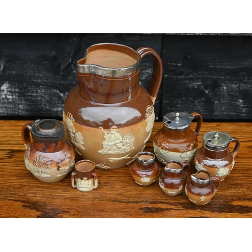 434 - # A Victorian Royal Doulton stoneware harvest jug with silver rim, to/w a mustard pot with silver co... 